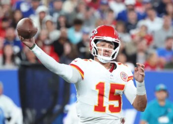 Patrick Mahomes throwing a football.