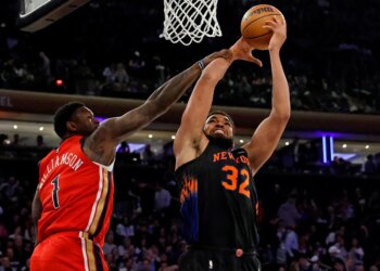 Karl-Anthony Towns goes up for a shot as New Orleans Pelicans forward Zion Williamson defends during the third quarter at Madison Square Garden in New York, New York, USA, Tuesday, March 24, 2026.