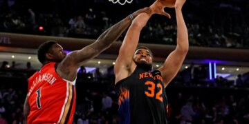 Karl-Anthony Towns goes up for a shot as New Orleans Pelicans forward Zion Williamson defends during the third quarter at Madison Square Garden in New York, New York, USA, Tuesday, March 24, 2026.