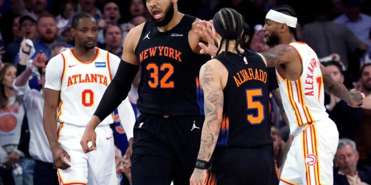 Karl-Anthony Towns is greeted by Jose Alvarado celebrate a score during the Knicks' 126-97 Game 5 blowout win over the Hawks on April 28, 2026 at Madison Square Garden.