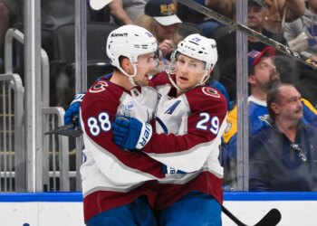 Apr 7, 2026; St. Louis, Missouri, USA; Colorado Avalanche center Martin Necas (88) celebrates with center Nathan MacKinnon (29) after scoring against the St. Louis Blues during the first period at Enterprise Center. Mandatory Credit: Jeff Curry-Imagn Images