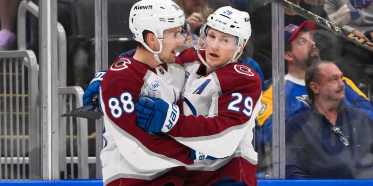 Apr 7, 2026; St. Louis, Missouri, USA; Colorado Avalanche center Martin Necas (88) celebrates with center Nathan MacKinnon (29) after scoring against the St. Louis Blues during the first period at Enterprise Center. Mandatory Credit: Jeff Curry-Imagn Images
