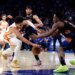Atlanta Hawks forward Jalen Johnson and New York Knicks forward OG Anunoby reach for the ball