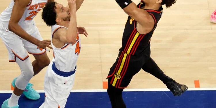 Atlanta Hawks forward Jalen Johnson (1) puts up shot as New York Knicks guard Landry Shamet (44) defends during the third quarter.