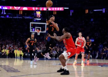 Guard Josh Hart #3 of the New York Knicks makes a jumping pass over forward Patrick Williams #44 of the Chicago Bulls during the first half at Madison Square Garden, Friday April 3rd, 2026, in New York, NY.