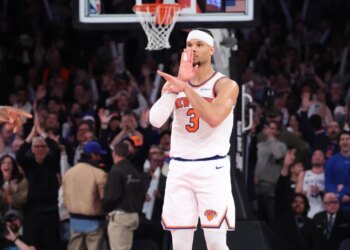 Josh Hart #3 reacts after he sinks a three-point shot with seconds left during the fourth quarter against the Celtics on April 9.