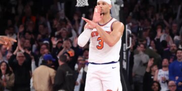 Josh Hart #3 reacts after he sinks a three-point shot with seconds left during the fourth quarter against the Celtics on April 9.