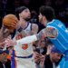 New York Knicks guard Jose Alvarado defends against Charlotte Hornets guard LaMelo Ball during a game.