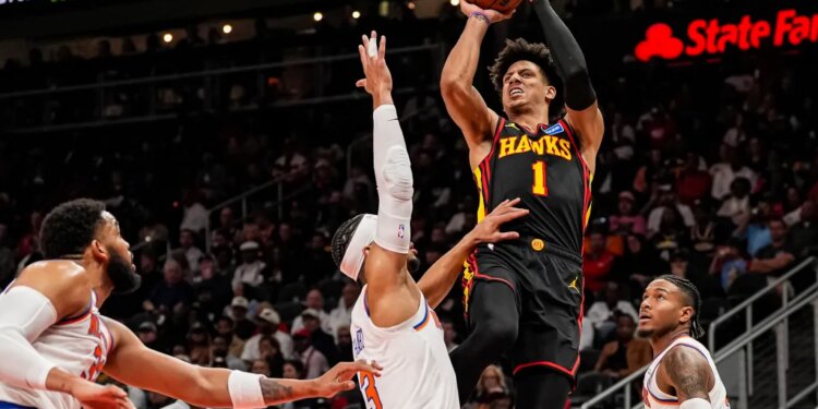 Atlanta Hawks forward Jalen Johnson (1) shoots over New York Knicks guard Josh Hart (3) during the second half.