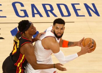 Atlanta Hawks forward Onyeka Okongwu (17) defends New York Knicks center Karl-Anthony Towns (32) during the first quarter.