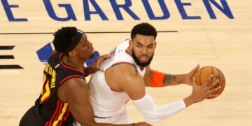 Atlanta Hawks forward Onyeka Okongwu (17) defends New York Knicks center Karl-Anthony Towns (32) during the first quarter.