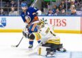 Kyle Palmieri #21 of the New York Islanders watches as Jeremy Swayman #1 of the Boston Bruins makes a glove save during the third period at UBS Arena, Wednesday, Nov. 26, 2025, in Elmont, NY.
