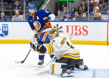 Kyle Palmieri #21 of the New York Islanders watches as Jeremy Swayman #1 of the Boston Bruins makes a glove save during the third period at UBS Arena, Wednesday, Nov. 26, 2025, in Elmont, NY.