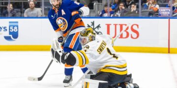 Kyle Palmieri #21 of the New York Islanders watches as Jeremy Swayman #1 of the Boston Bruins makes a glove save during the third period at UBS Arena, Wednesday, Nov. 26, 2025, in Elmont, NY.