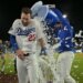 Los Angeles Dodgers right fielder Kyle Tucker (23) is doused with ice water from a cooler by right fielder Alex Call (12) after Tucker's walk-off single.