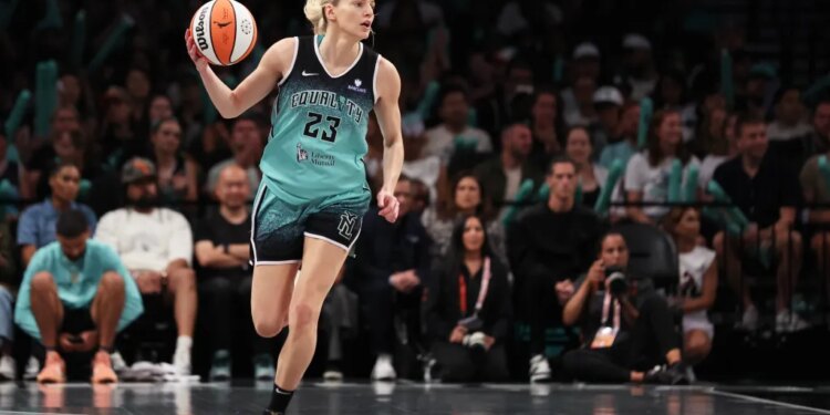 New York Liberty guard Marine Johannès (23) brings up the ball during the second half of a game against the Phoenix Mercury.