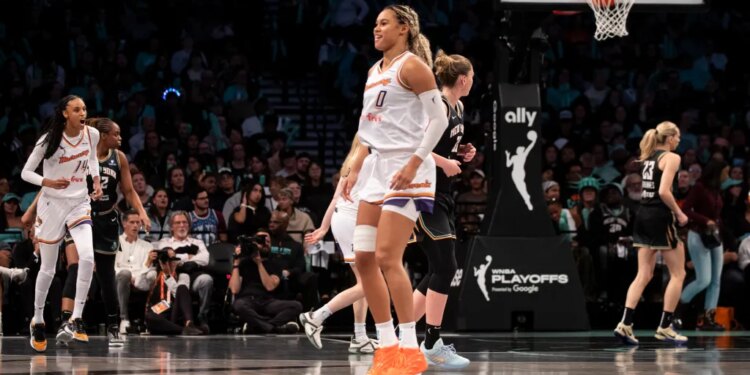 Satou Sabally of the Phoenix Mercury reacting to a shot over Emma Meesseman of the New York Liberty during a WNBA playoffs game.