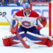 Montreal Canadiens goaltender Jakub Dobes (75) guards the goal during a game against the Tampa Bay Lightning.