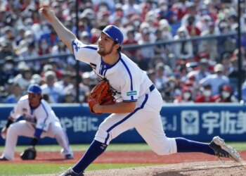 Yokohama DeNA BayStars pitcher Trevor Bauer delivering a pitch during a baseball game.