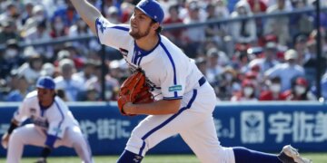 Yokohama DeNA BayStars pitcher Trevor Bauer delivering a pitch during a baseball game.
