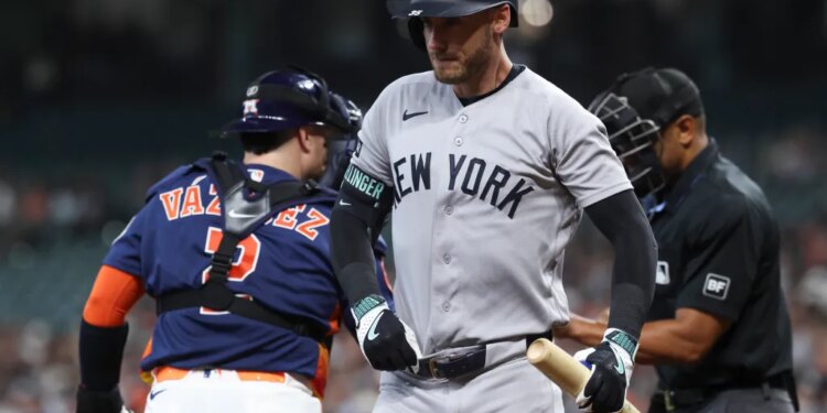 Cody Bellinger of the New York Yankees reacts after striking out against the Houston Astros.
