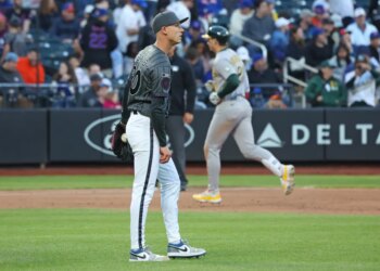 New York Mets pitcher Luke Weaver reacts as Athletics left fielder Tyler Soderstrom rounds the bases after hitting a three-run home run.