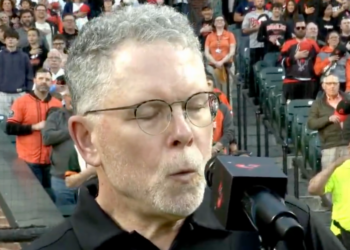 Whistler Chris Ullman is seen performing the national anthem prior to the Orioles-Giants game.