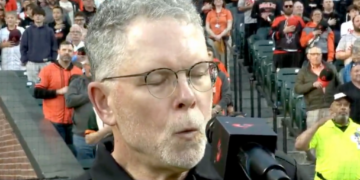 Whistler Chris Ullman is seen performing the national anthem prior to the Orioles-Giants game.