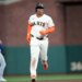 Rafael Devers of the San Francisco Giants rounding the bases after hitting a solo home run.