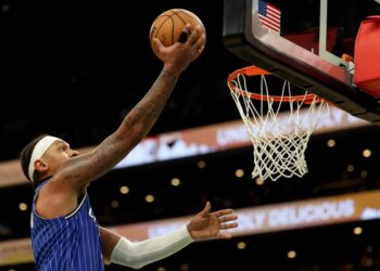 Orlando Magic forward Paolo Banchero scores during the second half of an NBA basketball game against the Boston Celtics, Sunday, April 12, 2026, in Boston.