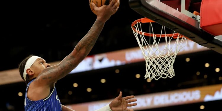 Orlando Magic forward Paolo Banchero scores during the second half of an NBA basketball game against the Boston Celtics, Sunday, April 12, 2026, in Boston.
