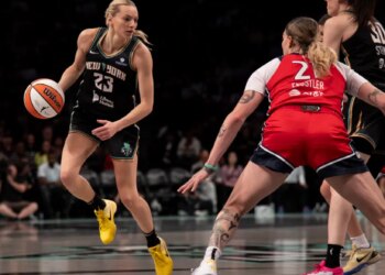 Marine Johannes dribbles the ball for the New York Liberty against Emily Engstler of the Washington Mystics.
