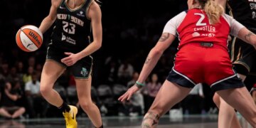 Marine Johannes dribbles the ball for the New York Liberty against Emily Engstler of the Washington Mystics.