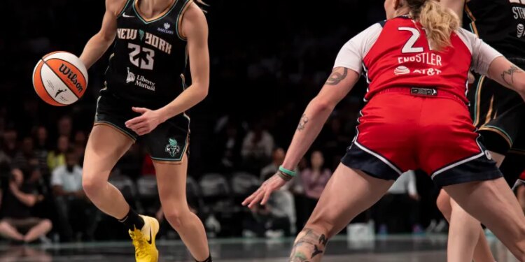 Marine Johannes dribbles the ball for the New York Liberty against Emily Engstler of the Washington Mystics.