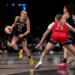 Marine Johannes dribbles the ball for the New York Liberty against Emily Engstler of the Washington Mystics.