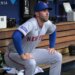 David Peteson sits in the dugout before the Mets' loss to the Dodgers on April 13, 2026 in Los Angeles.