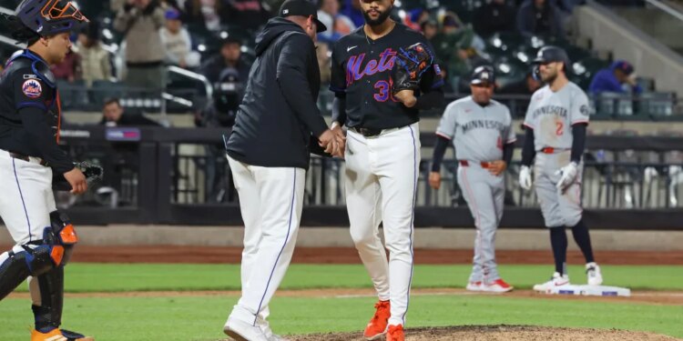 New York Mets pitcher Devin Williams (38) is taken out of the game.