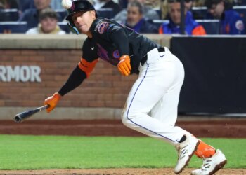 Jared Young bunts for a hit during the Mets' loss to the A's on April 10, 2026 at Citi Field.