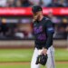 New York Mets pitcher Christian Scott walking off the field after being pulled from the game against the Minnesota Twins.