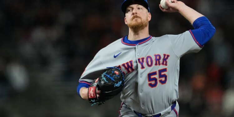 New York Mets pitcher Richard Lovelady throws a baseball.