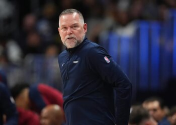 Denver Nuggets head coach Michael Malone stands on the sideline during the second half of an NBA basketball game April 1, 2025, in Denver.