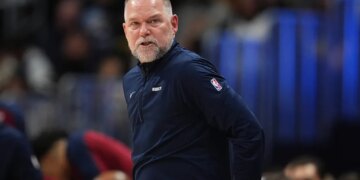 Denver Nuggets head coach Michael Malone stands on the sideline during the second half of an NBA basketball game April 1, 2025, in Denver.