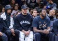 Nets center Nic Claxton (l.), Michael Porter Jr. (c.) and Day'ron Sharpe look on during the second half against the Atlanta Hawks at Barclays Center, Friday, April 3, 2026, in Brooklyn, NY.