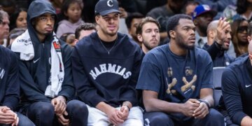 Nets center Nic Claxton (l.), Michael Porter Jr. (c.) and Day'ron Sharpe look on during the second half against the Atlanta Hawks at Barclays Center, Friday, April 3, 2026, in Brooklyn, NY.