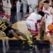 Michigan forward Yaxel Lendeborg falls on the court during a basketball game against Arizona.