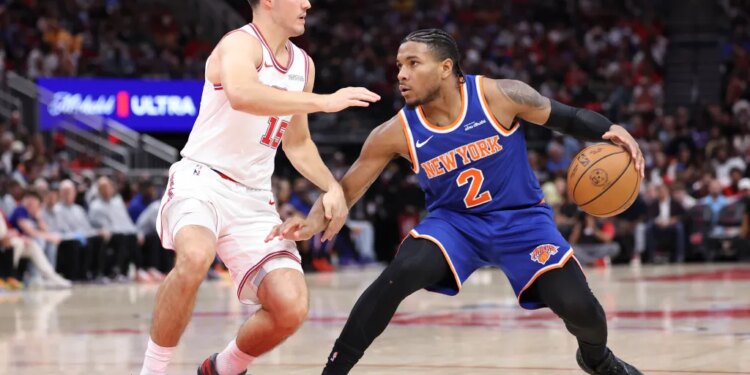Miles McBride looks to make a move on Reed Sheppard during the Knicks' 111-94 loss to the Rockets on March 31, 2026 in Houston.