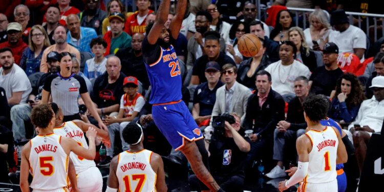 New York Knicks center Mitchell Robinson (23) slam dunks the ball during the second quarter.