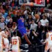 New York Knicks center Mitchell Robinson (23) slam dunks the ball during the second quarter.