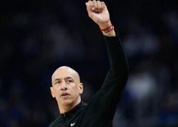 Sacramento Kings head coach Doug Christie gestures during a game.