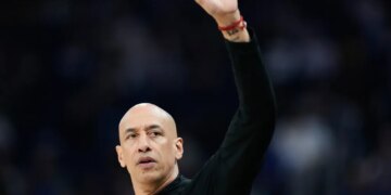 Sacramento Kings head coach Doug Christie gestures during a game.